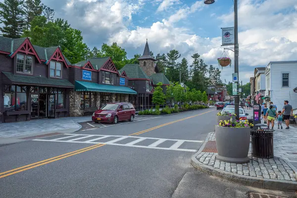 stock image Main Street in downtown Lake Placid, Upstate New York, shines during early evening, capturing the charm and vibrancy of this picturesque town.