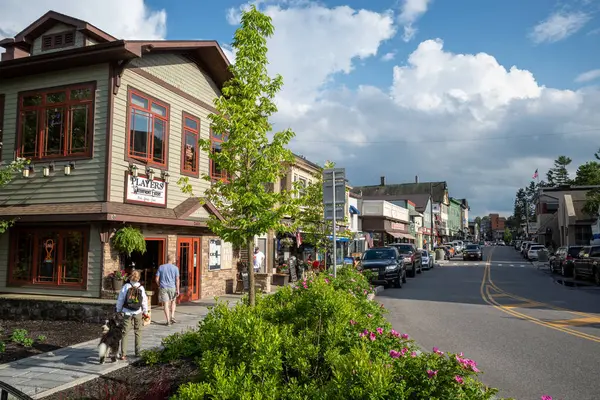 stock image Main Street in downtown Lake Placid, Upstate New York, shines under a sunny sky, capturing the charm and vibrancy of this picturesque town.