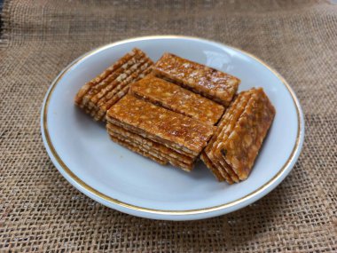 stack of ting ting enting enting indonesian traditional sweet peanut brown sugar candy snack 