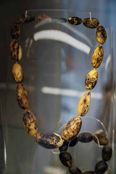 Amber Beads Glass Shelf Close — Stock Photo, Image