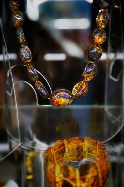 Amber Beads Glass Shelf Close — Stock Photo, Image