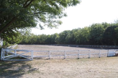 Beautiful photo of empty equestrian field for horse training. Equestrian background