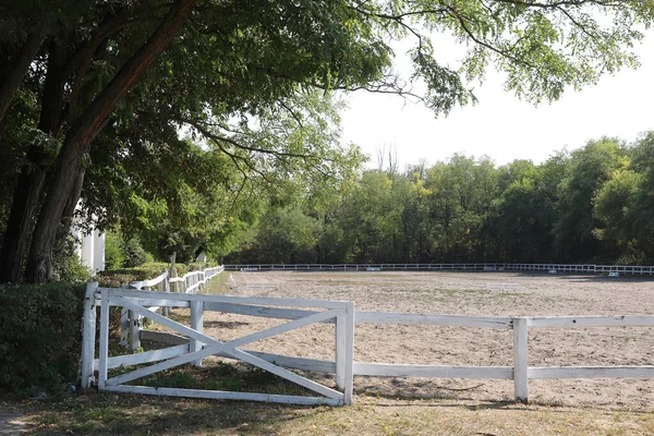 Beautiful photo of empty equestrian field for horse training. Equestrian background