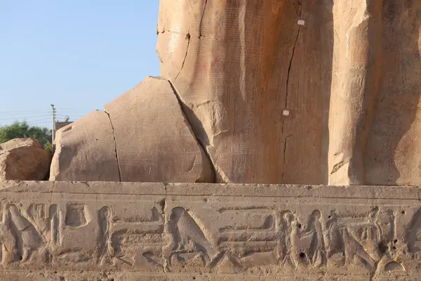 stock image Famous Colossi of Memnon. Massive ruined statues colossi of the Pharaoh Amenhotep III. Travel and tourist landmarks nearby Luxor Egypt West Bank, Thebes, Luxor,  North Africa