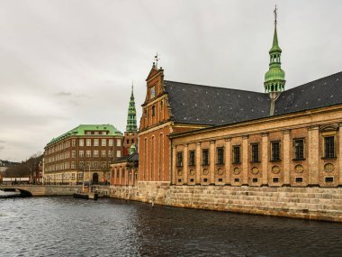 Copenhagen city buildings on canal side during fall, Denmark clipart