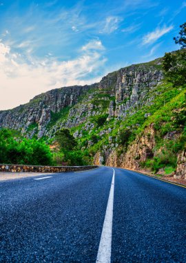 Vertical shot of winding road lines in Langeberg Mountains during sunset, Suurbraak, Overberg, Western Cape, South Africa clipart