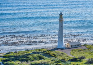 Gün batımında Slangkop Deniz Feneri 'nin yakın çekimi, Kommetjie, Cape Town, Güney Afrika