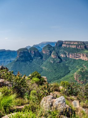 Vertical shot of Three Rondavels on a blue sky afternoon, Panorama Route, Graskop, Mpumalanga, South Africa clipart