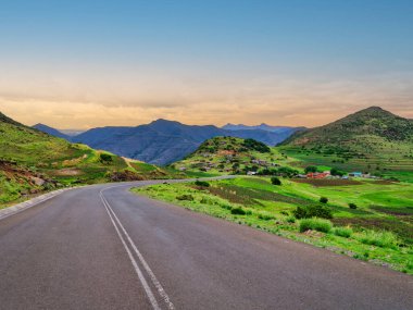 Winding road going through a lesotho village on the mountain, Mantsa, Kingdom of Lesotho clipart