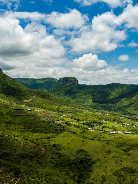 Beautiful Eastern Cape village Ngojini  in a valley surrounded by high peak mountains in South Africa clipart