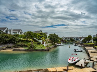 Water town of St Francis bay with canal side houses in South Africa clipart