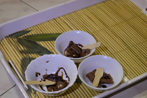 dark chocolate flakes topped with chocolate sauce served