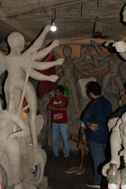 kumartuli, kolkata, west bengal, india - august 25, 2024 : incomplete durga idols at potters place to get final touch for a finished beautiful goddess 