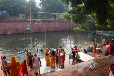 saraswati kund, rajgir hot spring, bihar, india- september 23, 2024: people get holy and medicinal dip in hot spring clipart