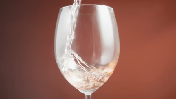 Close Rose Wine Being Poured Glass Creating Bubbles Slow Motion — Stock video