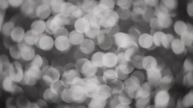 Işıltılı beyaz parıltının soyut bokeh arkaplanı. 