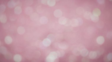 Işıl ışıl pembe parıltının soyut bokeh arka planı. 