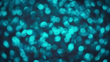 Işıltılı turkuaz parıltısının soyut bokeh arka planı. 