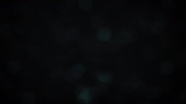 Işıltılı gri parıltının soyut bokeh arka planı. 