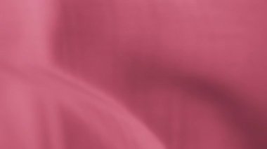 Pembe şifonlu dalgalı kumaş rüzgarda uçuşuyor. Yavaş çekim. 