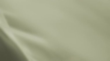 Rüzgarda sallanan açık sarı şifonlu şifonun soyut arkaplanı. Yavaş çekim. 