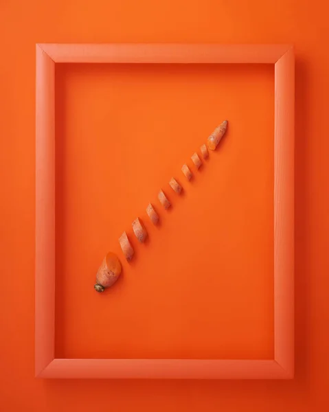 Chopped Carrot Wooden Picture Frame Orange Background — Stock Photo, Image