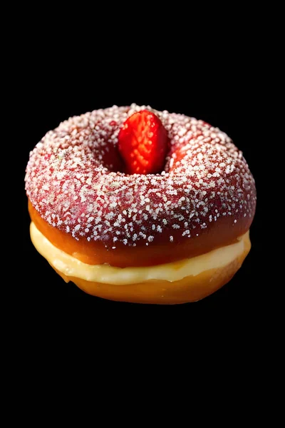 stock image donut with chocolate icing on black background