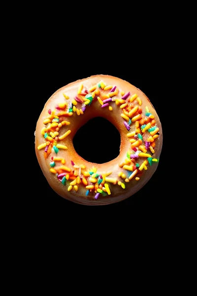 Donut Mit Streusel Auf Schwarzem Hintergrund — Stockfoto