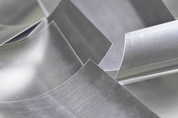 aluminum metal sheets. industrial metal pile, production rectangular pieces. curved material