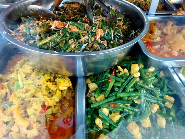 stock image long bean vegetables, bitter melon curry and beef skin curry in a tray. Indonesian food