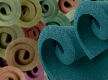 İki rulo mavi sünger sünger köpüğü ve bulanık renkli sünger ruloları.