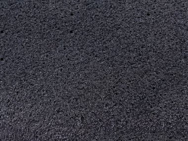 Siyah sünger köpük malzeme yüzey arka planı. desenli emici madde ve kalın gözenekler
