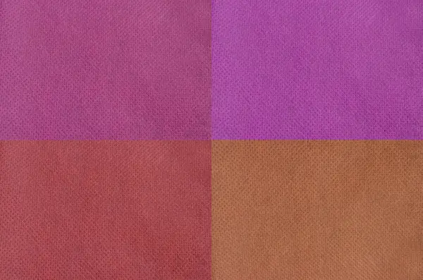 Renkli dokumasız kumaş yüzey dokusu arkaplanı. gözenekli polipropilen malzeme