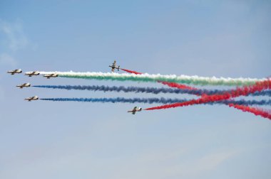 PAYERNE, SWITZERLAND - SEPTEMBER 6: Flight of Al Fursan aerobatic team from UAE in close formation on AIR14 airshow in Payerne, Switzerland on September 6, 2014