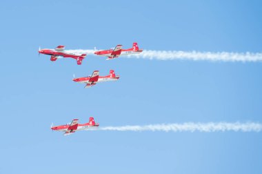 PAYERNE, SWITZERLAND - SEPTEMBER 6: Flight of PC-7 aerobatic team in close formation on AIR14 airshow in Payerne, Switzerland on September 6, 2014