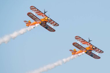 PAYERNE, SWITZERLAND - SEPTEMBER 6: Performance of Breitling Wingwalkers team during AIR14 airshow in Payerne, Switzerland on September 6, 2014