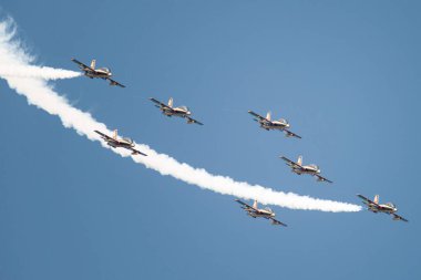 PAYERNE, SWITZERLAND - SEPTEMBER 6: Flight of Al Fursan aerobatic team from UAE in close formation on AIR14 airshow in Payerne, Switzerland on September 6, 2014
