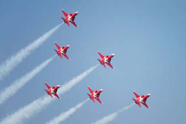 PAYERNE, SWITZERLAND - SEPTEMBER 6: Flight of Patrouille Suisse aerobatic team in close formation on AIR14 airshow in Payerne, Switzerland on September 6, 2014