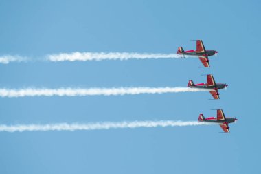 PAYERNE, SWITZERLAND - SEPTEMBER 6: Flight of Royal Jordanian Falcons aerobatic team in close formation on AIR14 airshow in Payerne, Switzerland on September 6, 2014