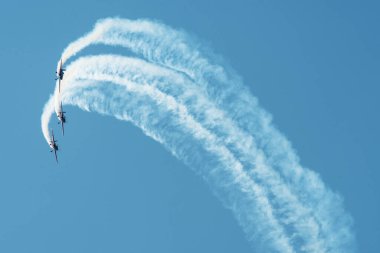 PAYERNE, SWITZERLAND - SEPTEMBER 6: Flight of Royal Jordanian Falcons aerobatic team in close formation on AIR14 airshow in Payerne, Switzerland on September 6, 2014