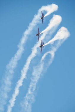 PAYERNE, SWITZERLAND - SEPTEMBER 6: Flight of Royal Jordanian Falcons aerobatic team in close formation on AIR14 airshow in Payerne, Switzerland on September 6, 2014