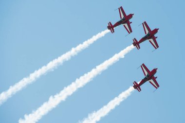 PAYERNE, SWITZERLAND - SEPTEMBER 6: Flight of Royal Jordanian Falcons aerobatic team in close formation on AIR14 airshow in Payerne, Switzerland on September 6, 2014