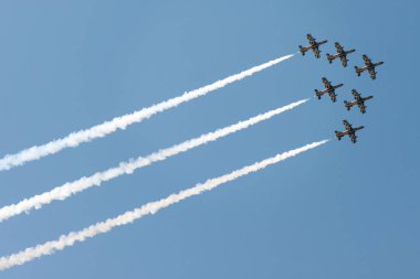 PAYERNE, SWITZERLAND - SEPTEMBER 7: Flight of Al Fursan aerobatic team from UAE in close formation on AIR14 airshow in Payerne, Switzerland on September 7, 2014