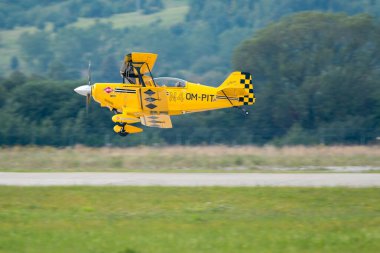 SLIAC, SLOVAKIA - AUGUST 30: Dusan Samko on Pitts S-2 C performs trick during SIAF airshow in Sliac, Slovakia on August 30, 2014