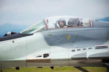 SLIAC, SLOVAKIA - AUGUST 30:  Pilot of MiG-29AS during SIAF airshow in Sliac, Slovakia on August 30, 2014