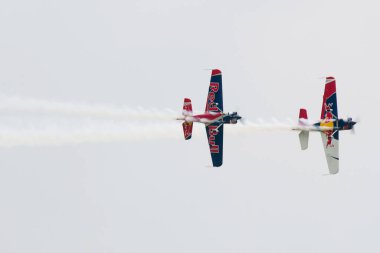 SLIAC, SLOVAKIA - AUGUST 30: The flying bulls duo performs flight maneuver on the SIAF airshow in Sliac, Slovakia on August 30, 2014