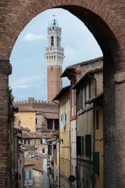 Historical part of the city of Siena in Tuscany with Bell tower of the Palazzo Pubblico, Italy