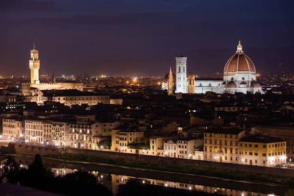 Palazzo Vecchio and Cathedral of Santa Maria del Fiore (Duomo) at night, Florence, Italy 