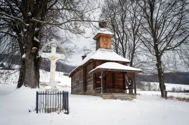 Greek Catholic wooden church of St George the Great Martyr in Jalova, Slovakia covered by snow