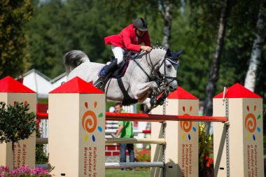 BRATISLAVA, SLOVAKIA - AUGUST 10: Hruska Zdenek (CZE) on horse Calata jumps over hurdle during Mercedes-Benz Grand Prix Bratislava, Slovakia on August 10, 2014